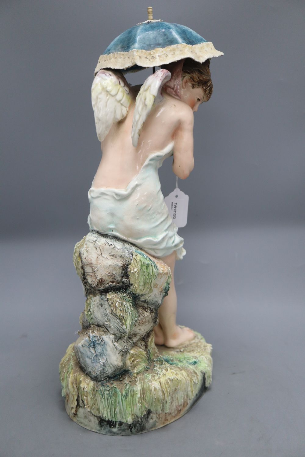 A Continental large pottery figure of a winged nymph,